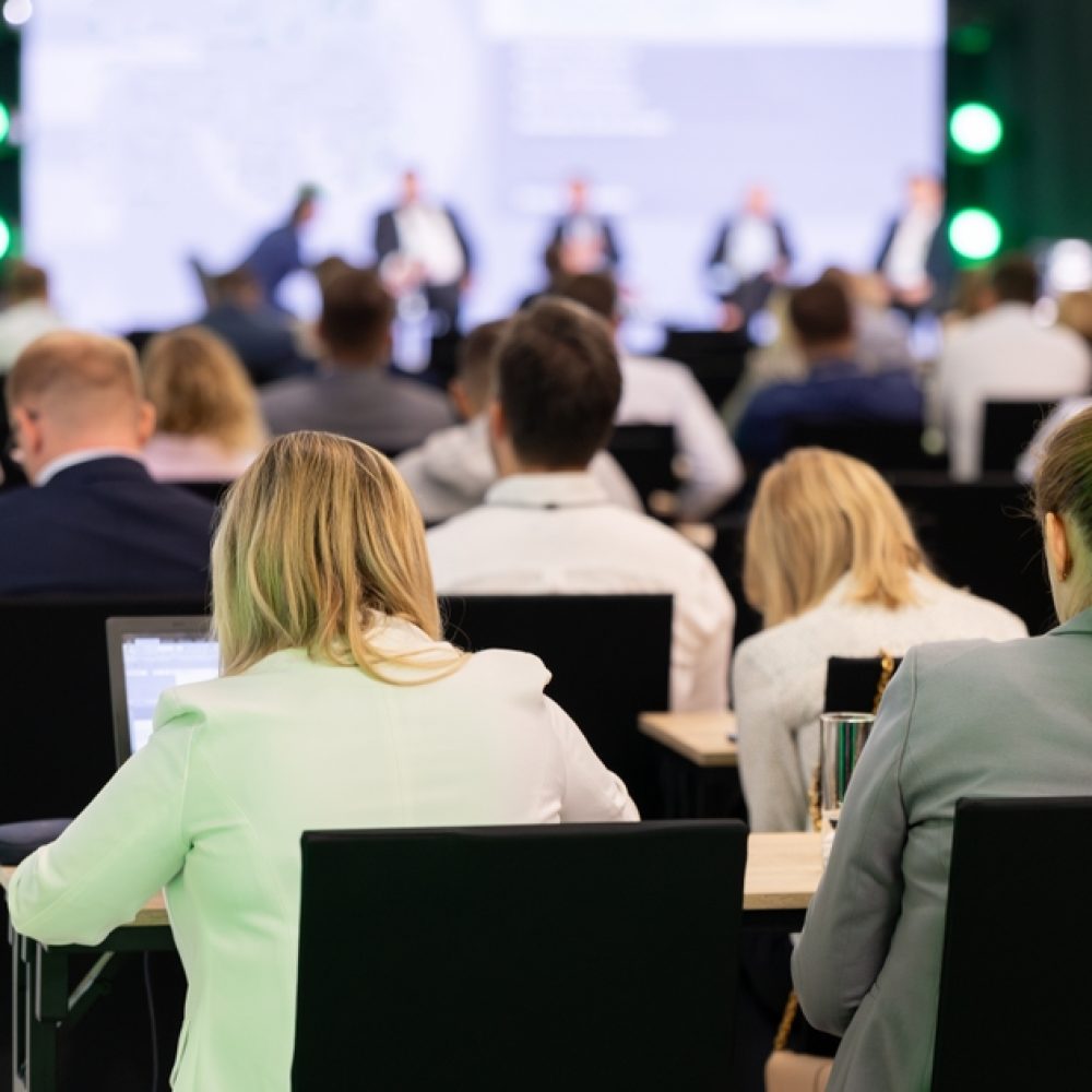 Rear,View,Of,The,Audience,At,A,Business,Conference,Meeting